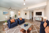 Chic living room with elegant furniture, modern decor, and sleek hardwood floors, perfect for style and comfort. Virtually staged for inspiration.