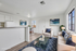 Bright and modern living area with cozy seating, stylish decor, and large windows for natural light. Open concept includes a chic dining space, perfect for contemporary living.