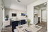 Tastefully staged open-concept living space showcasing elegant decor, a cozy seating area, and a modern kitchen with stylish cabinetry.