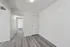 Bright, modern hallway with sleek light wood flooring, leading to a spacious room, perfect for elegant living.
