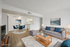 Inviting open-concept living and dining area with modern decor, plush seating, and a cozy atmosphere.