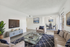 Bright and inviting living room with modern decor, sleek furniture, and a seamless flow into a cozy dining area, perfect for relaxation and entertaining.