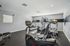 Modern fitness center with state-of-the-art exercise machines, bright lighting, and sleek design.