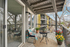 Charming apartment balcony with cozy seating, colorful potted flowers, and a serene view, ideal for relaxation and outdoor enjoyment.