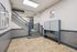 Charming apartment entrance with elegant tiled flooring and classic mailboxes, showcasing convenient access and tasteful decor.