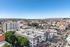 Breathtaking cityscape view highlighting a vibrant urban environment with diverse architecture and lush greenery.