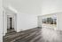 Bright and airy room with elegant hardwood floors, large window offering scenic views, and closet space for convenient storage.