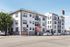 Charming urban apartment building with classic architecture, situated on a vibrant city corner.