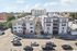Charming urban apartment buildings with vibrant street view, featuring stylish architecture and convenient city living.