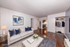 Modern living room with elegant white sofa, navy cushions, and sophisticated wall art, leading to a sleek kitchen and featuring rich hardwood floors with a cozy, upscale atmosphere.