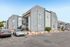 Charming apartment complex showcasing modern architecture, vibrant landscaping, and convenient parking.
