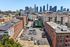 Vibrant cityscape view of downtown buildings with spacious urban parking and historic architecture, perfect for city living.
