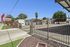Charming gated mobile home community with palm trees and a serene atmosphere at Desert Sky.