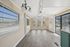 Bright and spacious room with large windows, elegant flooring, and stylish lighting ideal for a modern lifestyle.