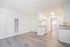 Bright and modern kitchen space featuring sleek cabinetry, ample counter space, and stylish flooring.