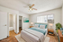 Bright and airy bedroom with a plush queen bed, stylish decor, and convenient ensuite bathroom.