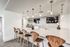 Clubroom Lounge and Dining Area with large kitchen with island and stainless steel appliances at arte apartments