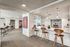 Clubroom Lounge and Dining Area with large kitchen with island and stainless steel appliances at arte apartments