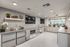 Clubroom Lounge and Dining Area with large kitchen with island and stainless steel appliances at arte apartments