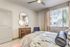 bedroom with ceiling fan bed and night stands at arte apartments