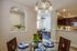 Dining room next to stairs and kitchen
