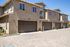 Exterior townhomes at Paseo village in Ramona, California. Garages.