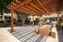 outdoor shaded seating area with grills