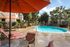 pool with shaded seating