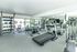 Community fitness center leading out to pool
