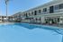 pool and lounge area with fitness center