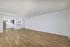 living room and kitchen with vinyl plank wood flooring and large window