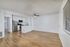 living room and kitchen with vinyl plank wood flooring and large window