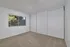bedroom with large windows and closet