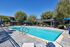 sparkling resident pool with loungers and tables