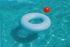 blue pool inner tube and red ball floating in a pool