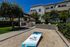 Outdoor rec area at Breeze Hill with cornhole boards
