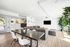 Community room at creekside with mailboxes and a tv, couch and table