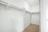 Walk in closet with shelving and hanging rods