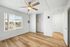 bedroom with wooden floor, ceiling fan, and closet