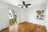 bedroom with wooden floor, ceiling fan, and patio