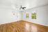 apartment with wooden floor and windows and ceiling fan