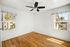 apartment with wooden floor and windows and ceiling fan