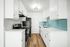 open plan kitchen with appliances and wooden floor
