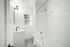 bathroom with toilet, tub, and sink