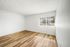 bedroom with wooden floor and window