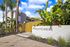 property entrance with palm trees