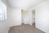 bedroom with sliding closet doors at Avaz Pacific Beach