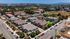 drone shot of paseo village neighborhood with hills and blue sky
