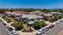 drone shot of paseo village neighborhood with hills and blue sky