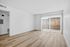living area with wooden floor, patio, and outdoor fence